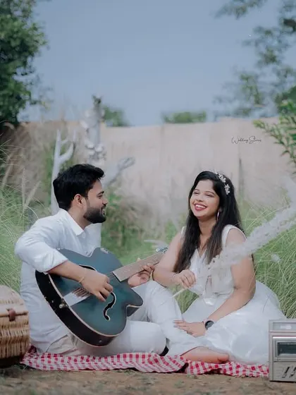 Another shot from the musical picnic, this one captures a moment of shared laughter and happiness.