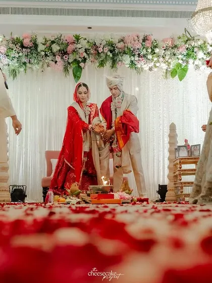 A low-angle shot of the Pheras, with the path covered in red rose petals, adding a touch of romance and drama.