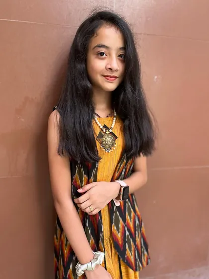 I designed this trendy dhoti pant and crop top set with a printed jacket for a teenage client.