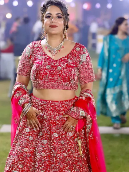 Ready for her brother's wedding in a stunning red lehenga. I created a glamorous look with a braided hairstyle.