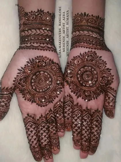 A classic mandala design on the palms with detailed finger work, a timeless choice for any occasion.