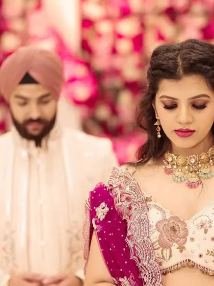 A moment of prayer and reflection together during their engagement ceremony. This image captures the spiritual and emotional depth of their commitment.