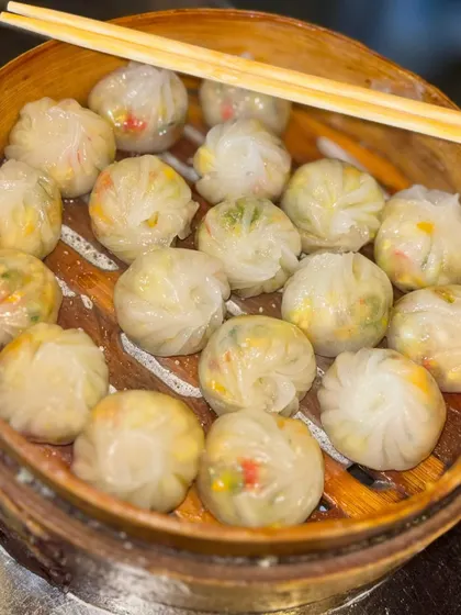 These perfectly round, purse-shaped dim sum are filled with a savory mix of vegetables. They are as beautiful to look at as they are to eat.