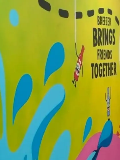 A side view of the Breezer office mural, highlighting the fluid shapes and bright color palette. This kind of art is perfect for creative brands that want their office to reflect their identity.