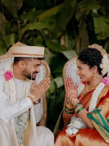 A quiet moment of connection between the bride and groom during their wedding ceremony. The shared glance and gentle smiles speak volumes about their bond.