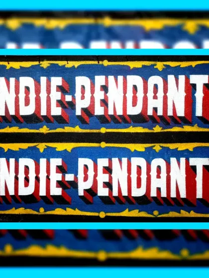 A close-up of the "Indie-Pendant" signs, focusing on the simple but effective 3D lettering.