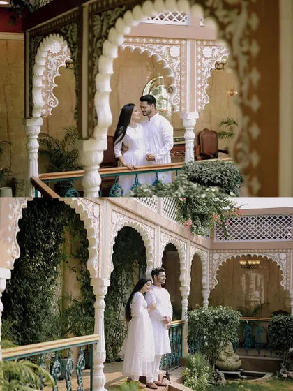 A wider shot of Sahas and Shradha, showcasing the beautiful arches and greenery of the pre-wedding location.