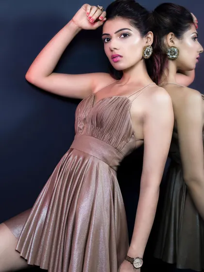 This metallic gold party dress is designed to turn heads. The ruched fabric and flattering silhouette make it a perfect choice for a night out, a birthday celebration, or any glamorous event.