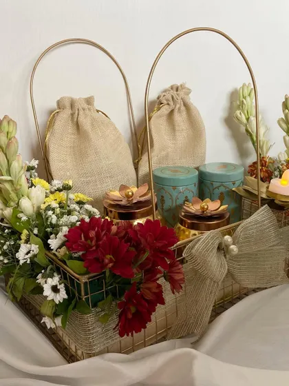 A side view of our Diwali Treats baskets, showing two hampers ready for delivery. The combination of fresh flowers and curated gifts makes for a heartwarming festive gesture.