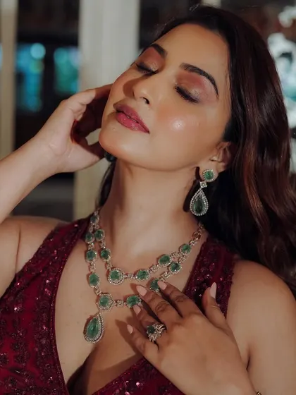 A moment of pure glamour. The soft, smokey eye and perfectly blended skin create a look that is both dramatic and elegant.