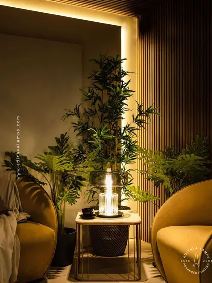 An elegant table lamp designed with a fluted crystal base and a smoked glass upper shade. This piece combines classic materials with a modern form to create a sophisticated light source for a living room or bedroom.