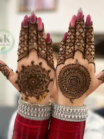 A gorgeous Karwachauth design with matching mandalas and detailed finger work, perfectly complementing the bridal bangles.