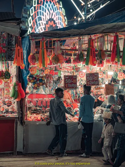 A stall at a local fair. The preset enhances the warm lights of the mela, giving the photo a nostalgic and lively feel.