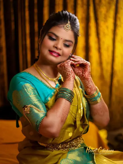 A candid "getting ready" shot of the bride putting on her earrings. These small moments are a beautiful part of the wedding day story.