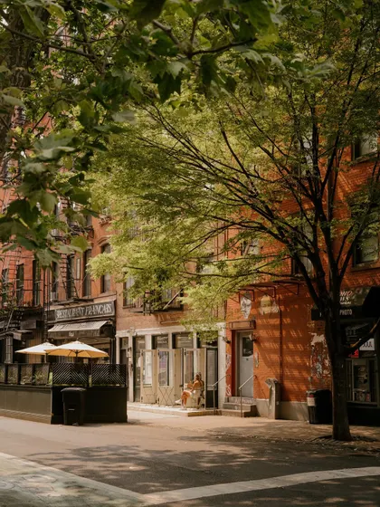 A quiet summer moment on a tree-lined street in New York. This shot, taken on a Leica Q3, captures the softer side of the city, focusing on light and atmosphere.