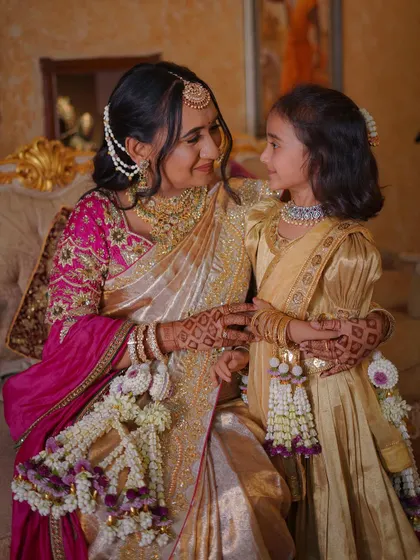 A sweet moment between mother and daughter. It was a joy to create matching floral kalire for them to wear at this special family celebration.