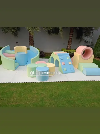 A look at some of our modular pastel pieces, including a tunnel, a small climber with a slide, and stepping stones, which can be configured in many ways.
