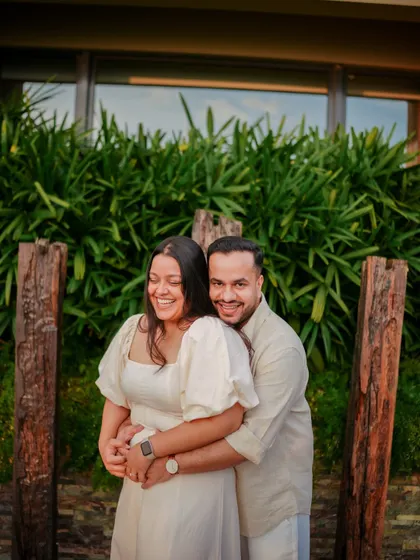 A joyful, candid hug captured at a resort. These relaxed moments show the couple enjoying their getaway, making the proposal feel like a natural part of their special trip.