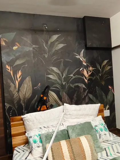 This dark, moody tropical wallpaper creates a dramatic and sophisticated atmosphere in a bedroom. I ensure the pattern is seamless, even in low light, for a flawless finish.