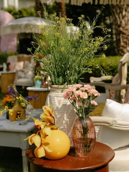 A close-up of the floral arrangements, showing a mix of textures and colors that create a wild, garden-like feel.