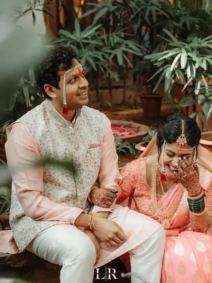 A shared laugh between the couple during a quiet moment away from the crowd. Our goal is to make you feel comfortable enough to be yourselves, allowing us to capture your true connection.