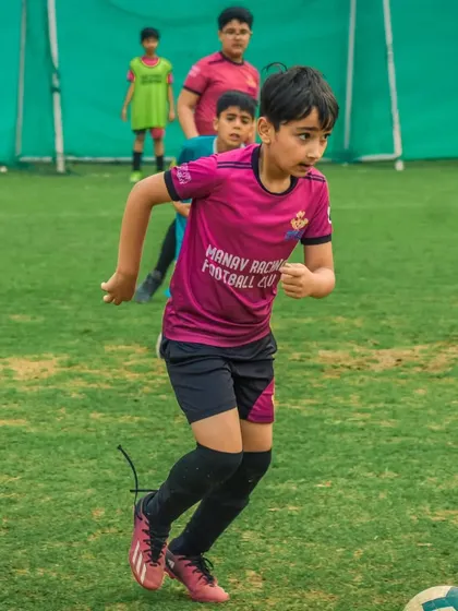 A player from Manav Rachna Football Club on the run.