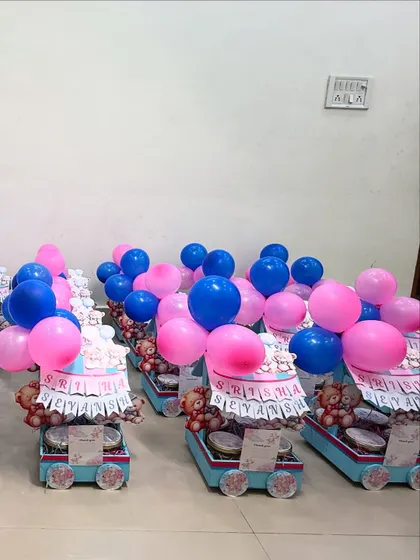 Celebrating twins? We make that extra special! Here are our custom pink and blue teddy-themed cart hampers for Srisha and Sevansh's naming ceremony, complete with balloons to double the fun.