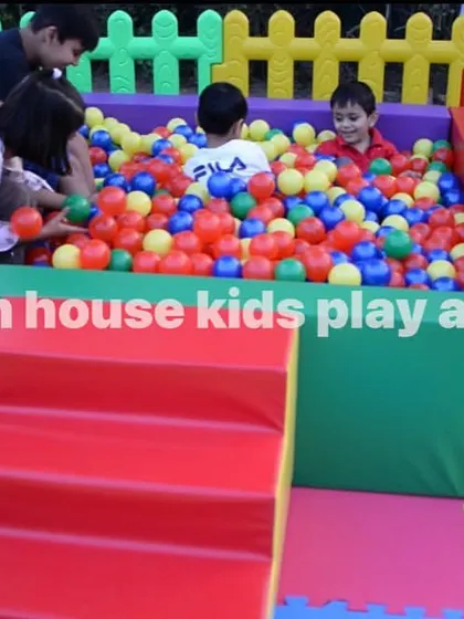 The colorful ball pit is always a huge hit, as seen here with multiple kids jumping in.