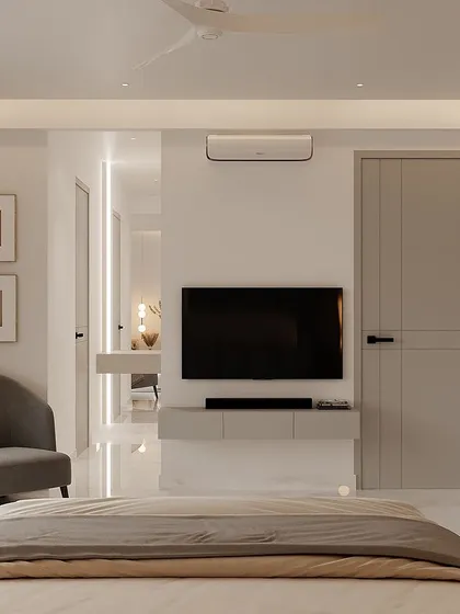 A serene and minimalist bedroom retreat in a grey and white palette. The design is clean and modern, with a floating TV console and simple, elegant furniture.