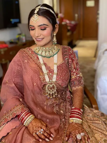 A close-up of Simran's beautiful eye makeup. The soft, blended shades and defined lash line make her eyes the star of the show.