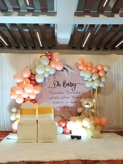 A full view of the 'Twinkle Twinkle Little Star' themed baby shower, showing the setup on a white carpet in a banquet hall.