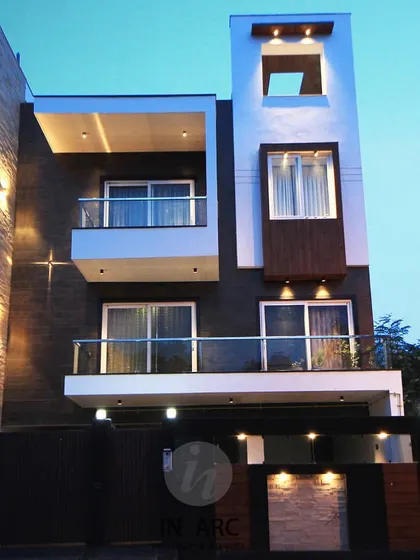 A residence at dusk. I pay close attention to exterior lighting design, as it completely transforms the building's character after sunset, highlighting its architectural forms.
