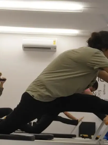 A deep lunge stretch on the reformer, perfect for opening up the hip flexors after a tough workout.