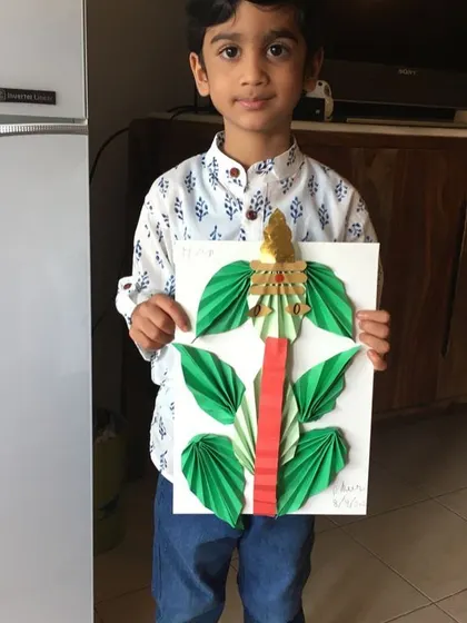 This child's artwork is a great example of using simple materials to create something beautiful and meaningful, which is a core principle of our art program.