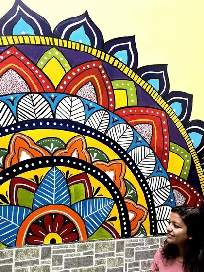 Looking up at the completed mandala mural. The design is a semi-circle, which works beautifully above furniture or along a half-wall.