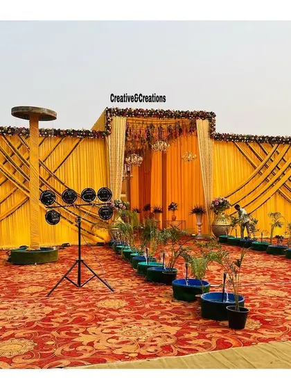 A full view of the grand yellow-themed outdoor setup, perfect for a large daytime wedding or pre-wedding function.