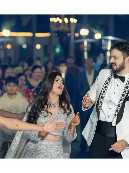 The couple makes their grand entrance to the dance floor, ready to celebrate their new beginning with friends and family.