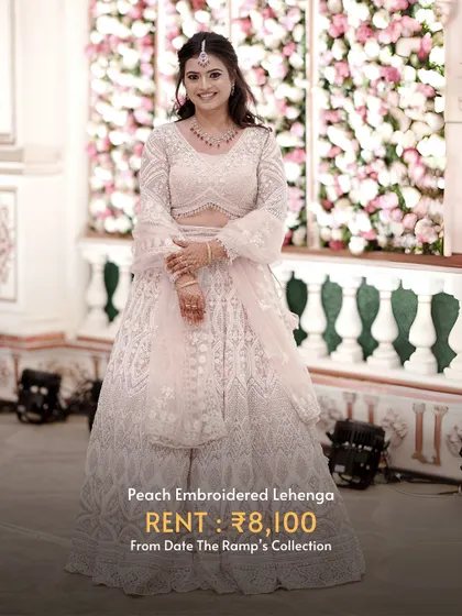This peach embroidered lehenga is soft, romantic, and perfect for a spring or summer wedding.