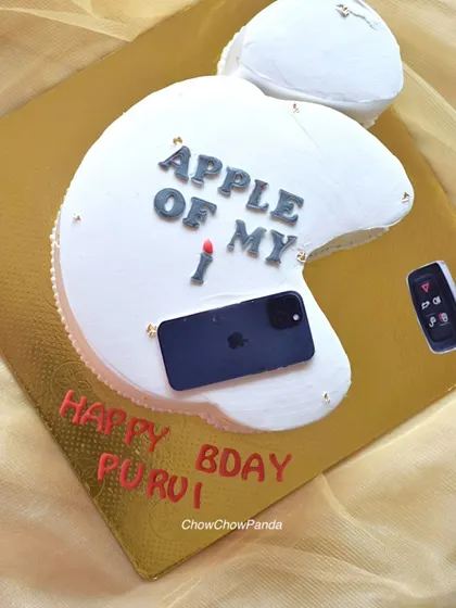 A close-up of the Apple logo cake, showing the fun, personalized details.