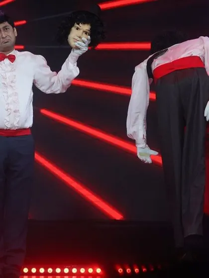 A magical illusion act from "Ardhavatrao 100 Not Out," where I appear to separate the puppet's head from its body, much to the audience's amazement.