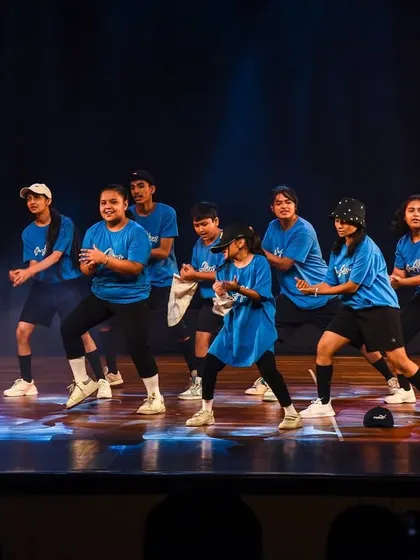 The crew getting into the groove, with smoky stage effects adding to the cool, urban vibe of the performance.