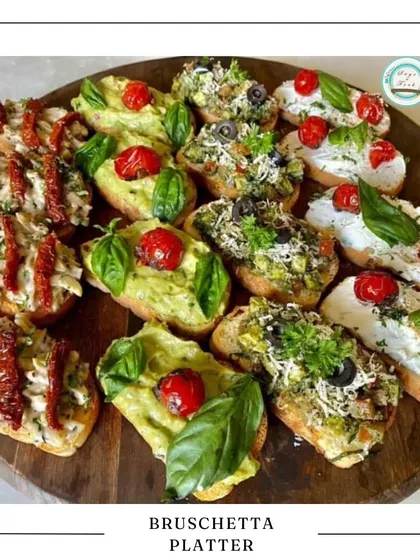 My Bruschetta Platter is a splash of Italian sunshine. I use toasted artisanal bread with a variety of fresh toppings like creamy avocado with basil, rich sun-dried tomatoes, and classic olive tapenade, making it a perfect appetizer for any get-together.