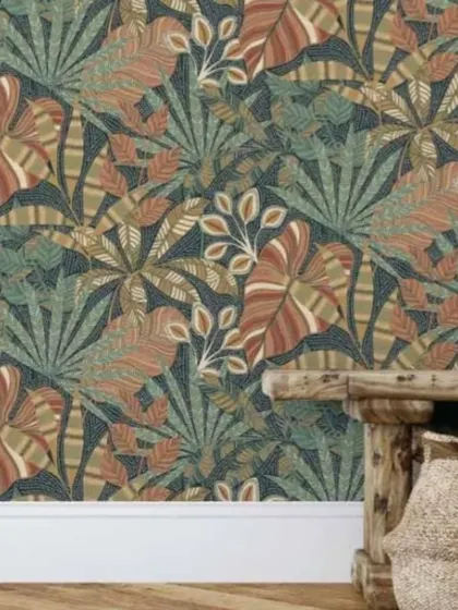A bold tropical leaf wallpaper with intricate dot-work details. The rich, earthy tones on a dark background create a warm and inviting yet dramatic effect.