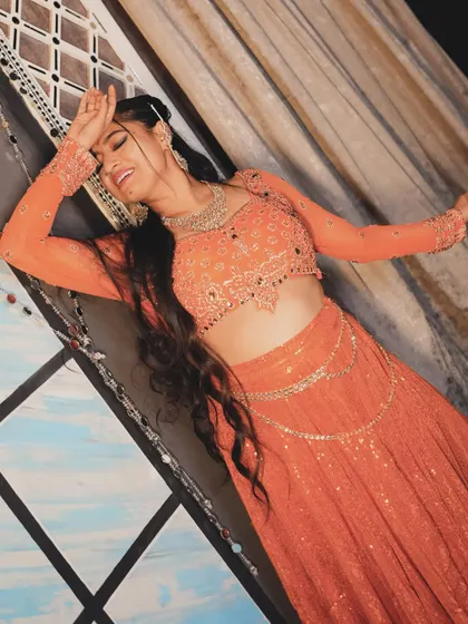 A dramatic, happy pose from the 'Jhanjhariya' shoot. I love the color of this outfit.