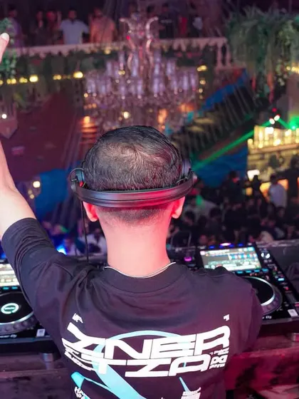 My view from behind the decks at Bombay Adda, with my hand up, leading the crowd.