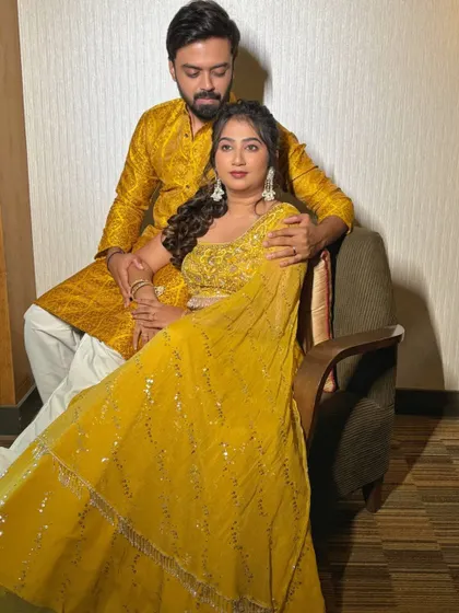 A beautiful couple portrait from the Haldi ceremony. Her soft makeup and his matching yellow kurta create a harmonious and lovely picture.