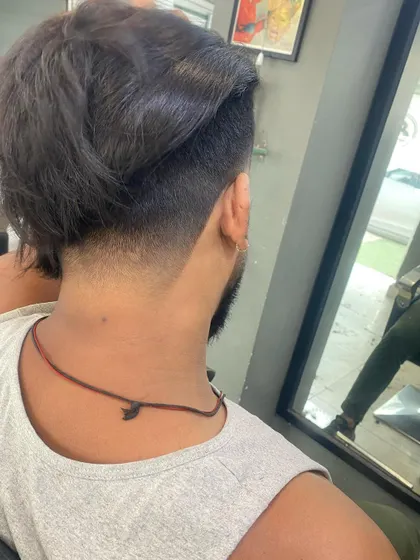 The back view of an undercut with longer hair on top, showing the sharp contrast in length.