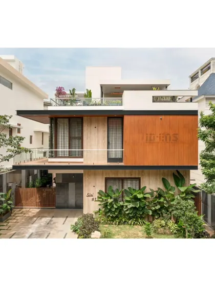 Our architectural work focuses on creating a strong connection with the environment. The facade of the Prakash Reddy residence uses a balanced composition of wood, stone, and glass, surrounded by tropical landscaping to create a modern home that feels integrated with its green surroundings.