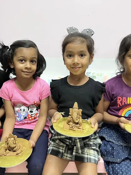 A group of friends proudly displaying their finished Ganesha idols. My workshops are a great way for kids to socialize and create together in a screen-free environment.