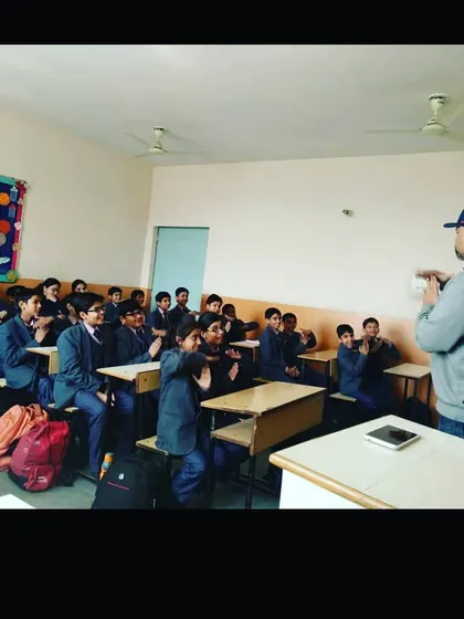 Involving students is the core of my teaching philosophy. Here, I am leading an interactive workshop, getting students to participate directly. This method ensures they remember what they learn because they are a part of the lesson itself.